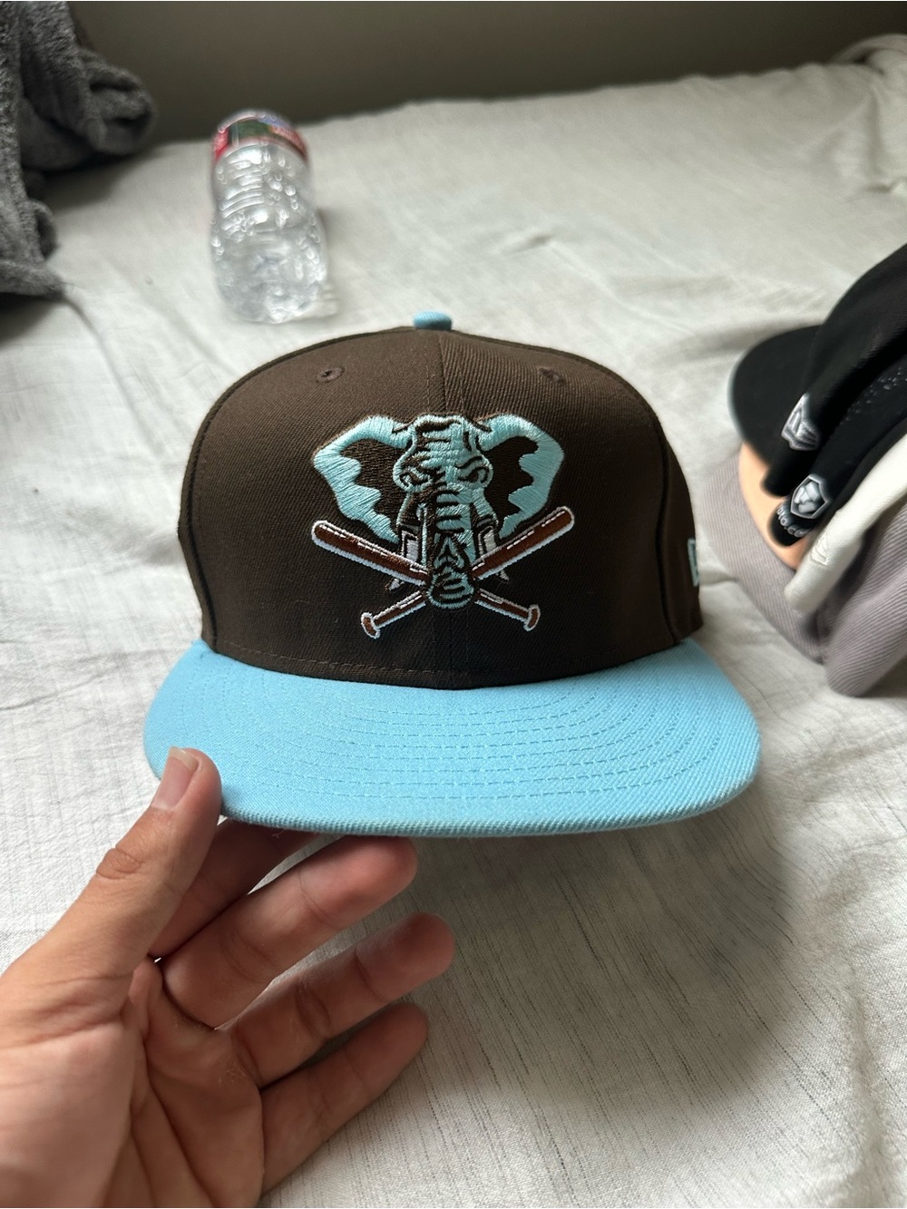 New Era Brown Snapback Hat with Light Blue Brim and Embroidered Elephant